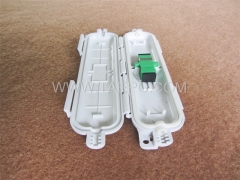 Caja de empalme para cable drop, exterior, 160x47x17 mm, SC, 1 entrada y 1 salida, sin adaptador